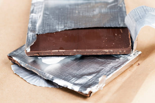istock an old chocolate bar on which there are traces of human hands 1354600455