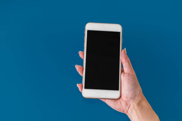 istock Woman hand holding phone 1354608966
