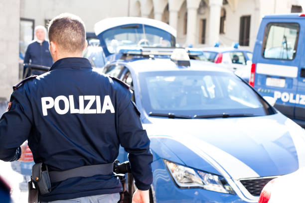 Padua, Italy - November 2, 2021. Police patrol car and officer in Padua during security activity. See Seat Leon as Italian Police Patrol car.