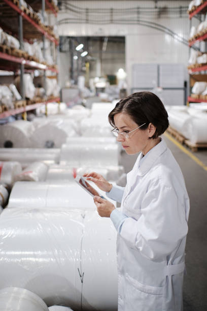 istock Female worker using tablet at the factory 1354611306