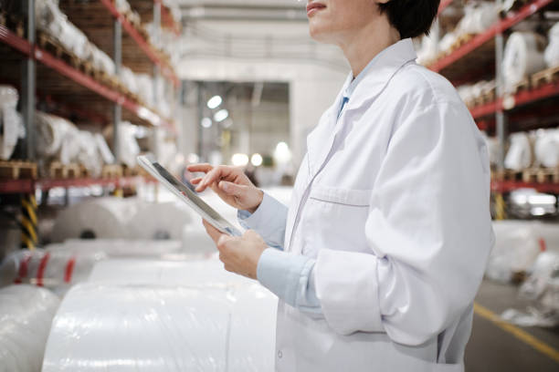 istock Female worker using tablet at the factory 1354611315