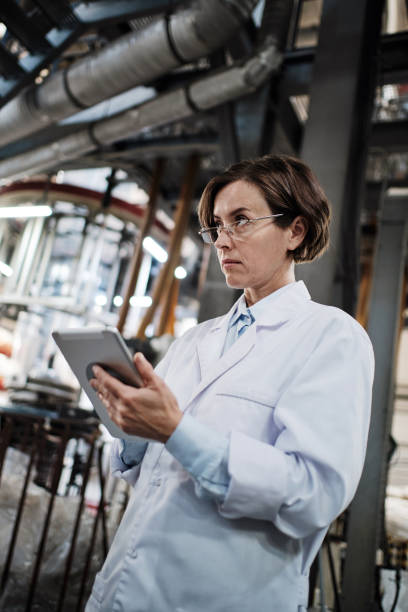 istock Female worker using tablet at the factory 1354611318