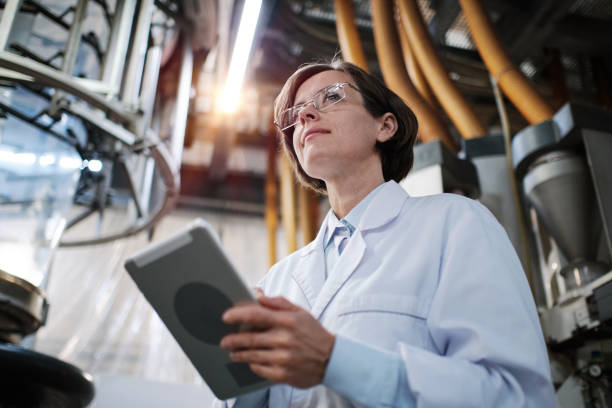 Female worker using tablet at the factory