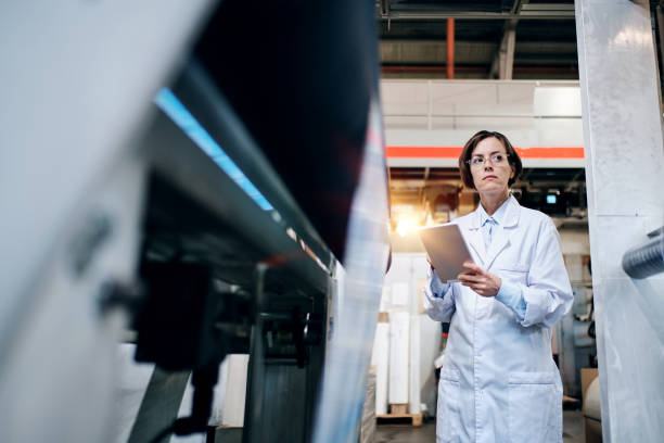 istock Female worker using tablet at the factory 1354611344
