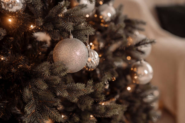 istock beautiful christmas tree and gifts 1354612245