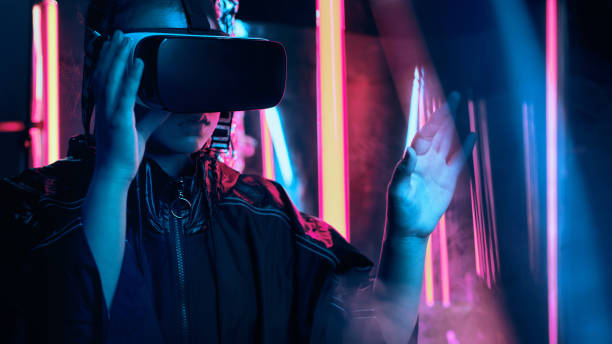 istock Teenager in virtual reality goggles gesturing on virtual screen 1354616787