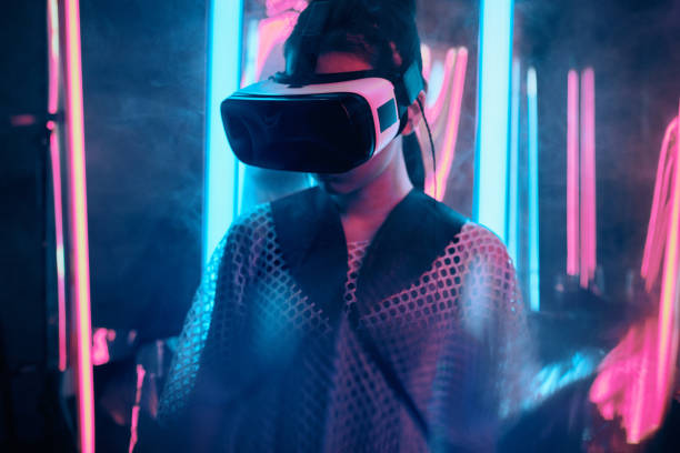 Neon lgiht portrait of girl in VR glasses stock photo