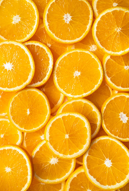 istock Orange fruit slices citrus arrangement full frame background 1354618866