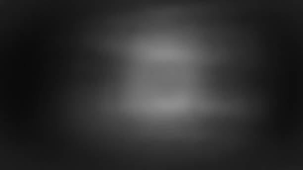 istock Abstract background, wall of black paper is blurry with some bright grayish white light.for graphic design ,spacefor text 1354634885