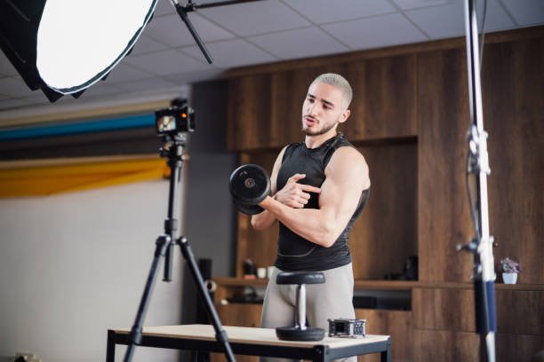 istock Muscular Athletic Young Male Instructor Streaming Online Bodybuilding Training Course 1354641647