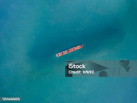 istock Cargo ship in the ocean. 1354660655