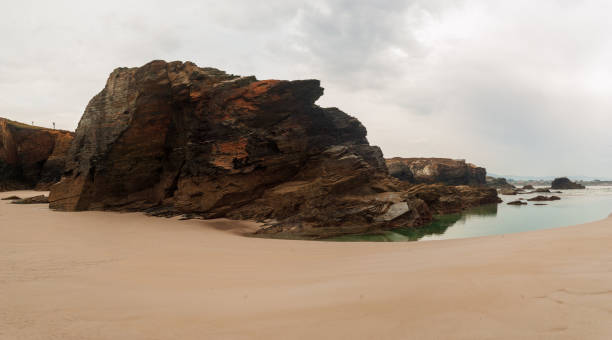 istock Eroded rock on the beach of the cathedrals. 1354662411