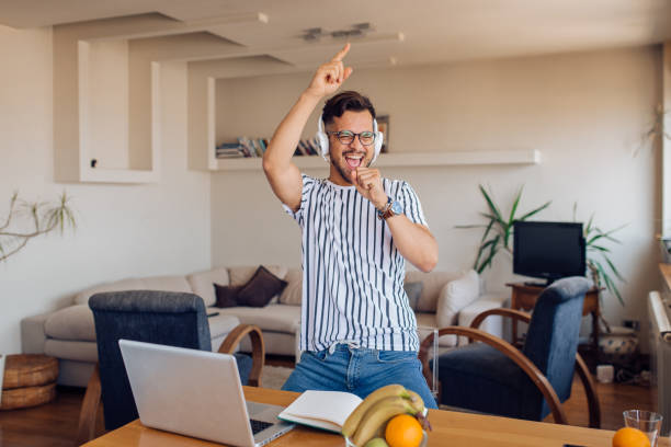 istock Young freelancer making his own party after work 1354674649