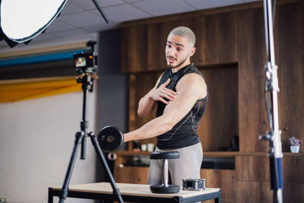 istock Muscular Athletic Young Male Instructor Streaming Online Bodybuilding Training Course 1354680232