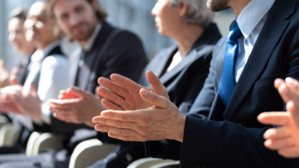 istock Business people applauding at meeting 1354681091