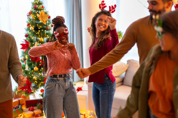 istock Friends singing and dancing while celebrating New Year at home 1354683440