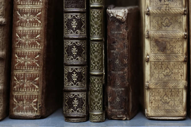 istock Old worn books on a shelf in the library's shelfs 1354684021