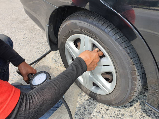 istock Technician checking tire pressure and readiness for driving safety 1354685851