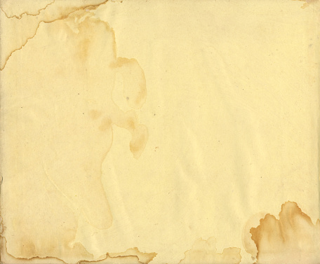 Water-stained paper background in dark cream colour.