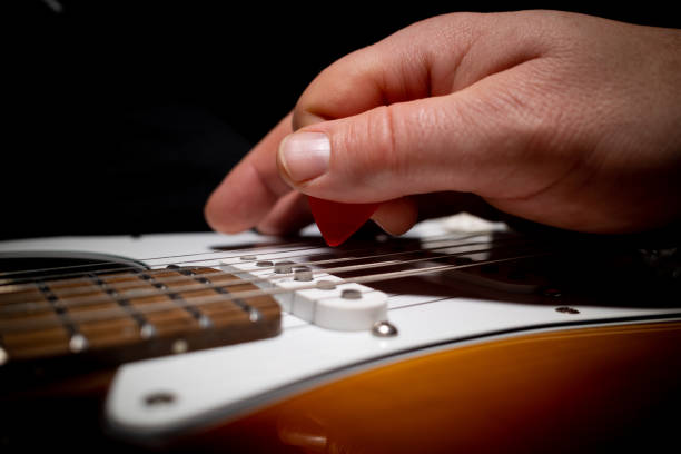 istock an electric guitar is played with a red pick 1354692656
