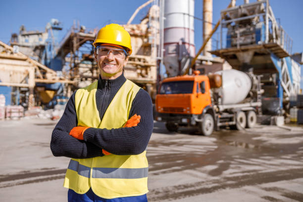 istock Cheerful man engineer standing outdoors at factory 1354697208