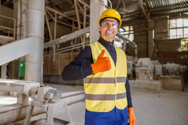 istock Cheerful man factory worker doing thumbs up gesture 1354697260