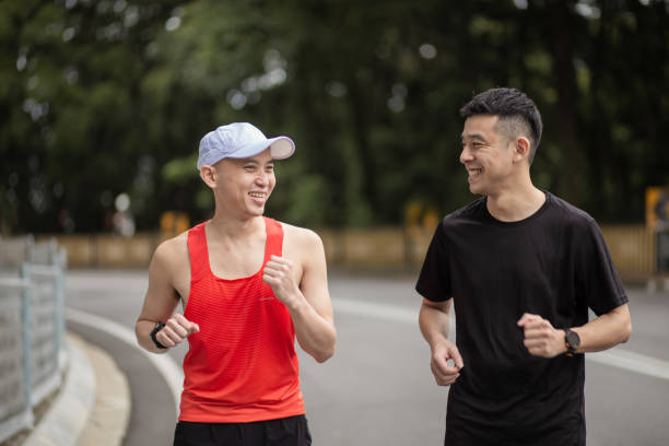 istock Asian Chinese men athletes running practicing during weekend 1354697450