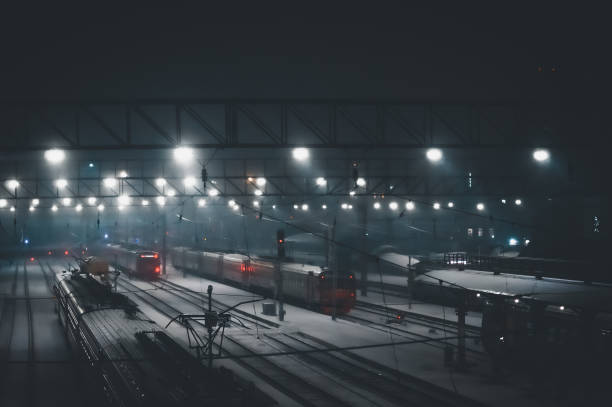 istock Defocused lights at the railway station at night. Selective focus, background 1354699566