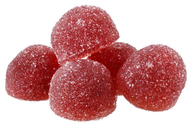 istock Handful of red and orange candy close up 1354701237