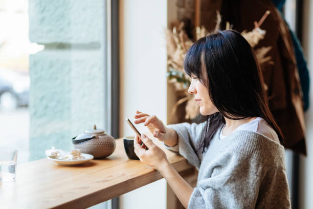 istock Image of young female reading sms 1354705477
