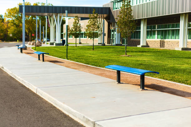 Outdoor wood and metal bench at building exterior