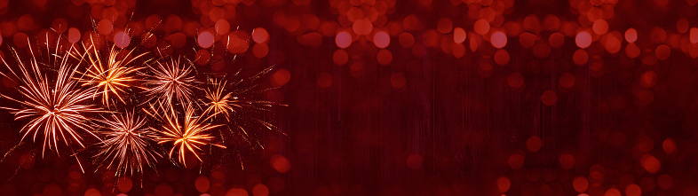 HAPPY NEW YEAR 2022 - Festive silvester background panorama greeting card banner long - Golden firework and bokeh lights on rustic red texture