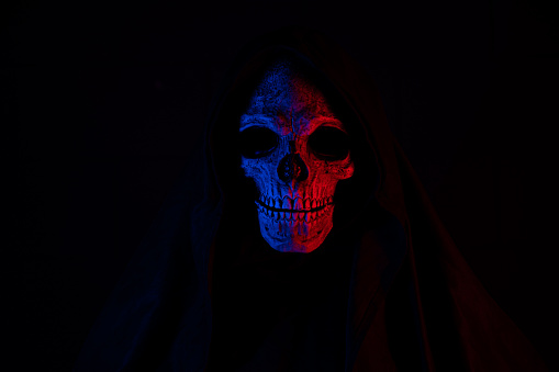 Scary grunge grim reaper, horror wallpaper with spooky skull, Halloween.
