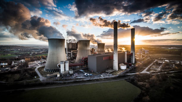 istock Back lit coal fired power station - Aerial Shot 1354710667