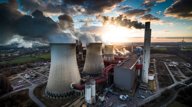 istock Fossil fuel (coal) fired power station - Aerial shot 1354710674