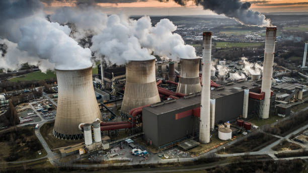 istock Air Pollution by coal fired power station - Aerial Shot 1354710683
