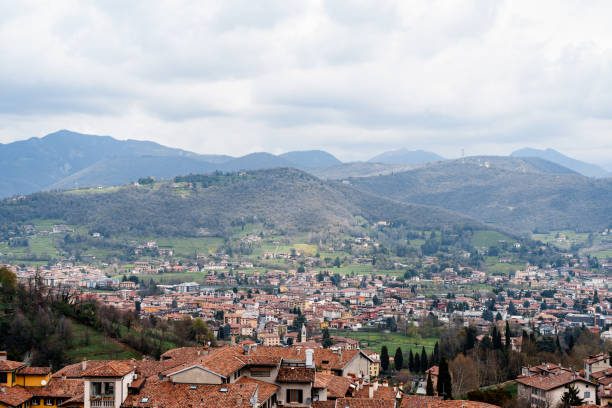 istock Bergamo city surrounded by mountains. Italy 1354711016