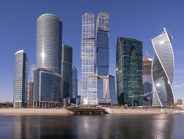 istock Modern glass skyscrapers in a waterfront cityscape 1354716170