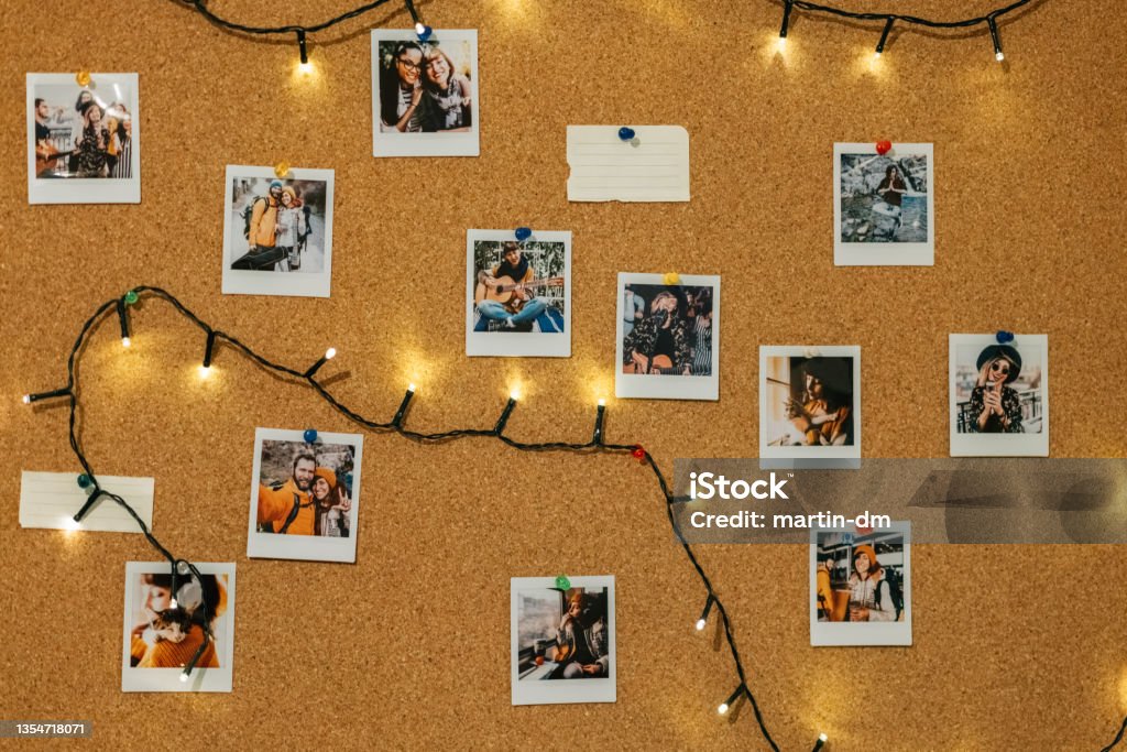 Collection of instant photo memories Instant photos on corkboard Photograph Stock Photo