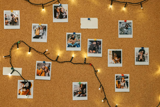 Collection of instant photo memories Instant photos on corkboard string instrument photos stock pictures, royalty-free photos & images