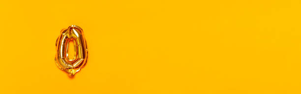 Zero number gold air balloon on a yellow background. Decoration elements for banner, cover, birthday or anniversary party invitation design