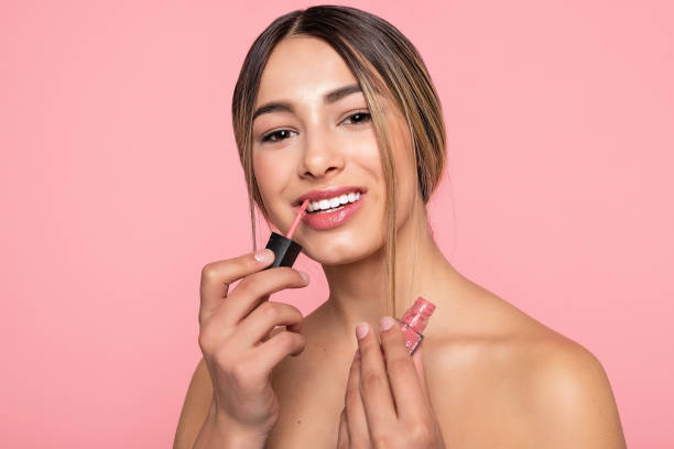 istock Sexy woman lips with pink makeup and gloss 1354718559