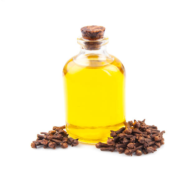 istock Clove essential oil in bottle and clove seed 1354721265
