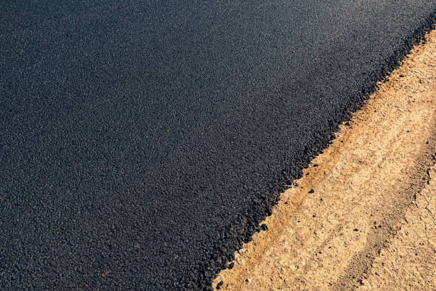 Laying of new black asphalt. Renovation of the expressway and the highway outside the city. Laying of new black asphalt. Renovation of the expressway and the highway outside the city. tar stock pictures, royalty-free photos & images