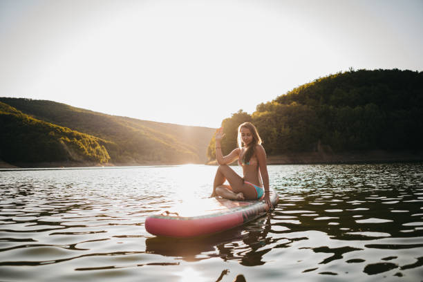 istock A woman does yoga on water 1354725222