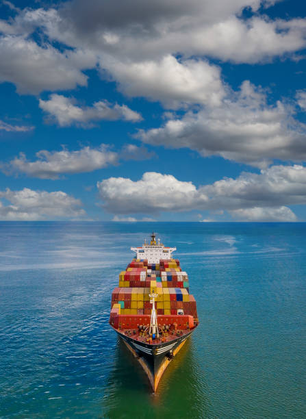 istock Aerial view of cargo ship in transit. 1354727547
