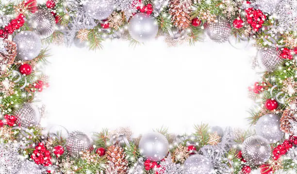 Photo of Christmas Card with Fir Branches, Silver Balls and Snowfall on White Background