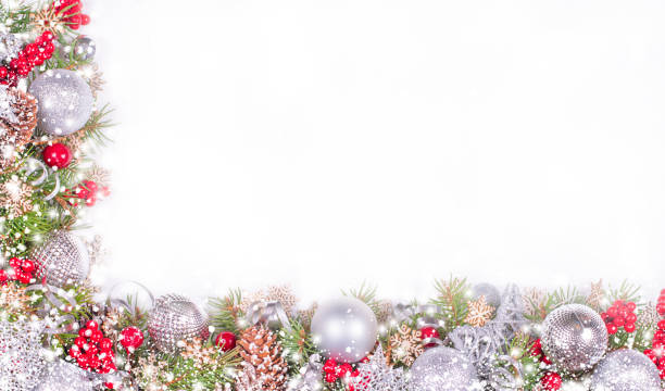 istock Christmas Card with Fir Branches, Silver Balls and Snowfall on White Background 1354732546