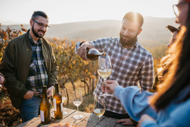 istock Friends enjoy vine tasting in the vineyard 1354733517