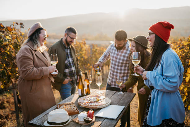 istock Friends enjoy vine tasting in the vineyard 1354734788